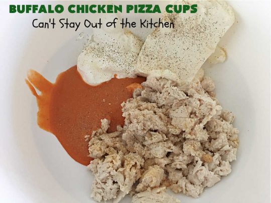 Buffalo Chicken Pizza Cups | Can't Stay Out of the Kitchen | these scrumptious miniature #pizzas include #BuffaloChickenDip in the centers & they're topped with 3 #cheeses including #mozzarella, #TacoCheese & #BlueCheese crumbles. Sensational #appetizer for #holidays, #tailgating parties, potlucks or the #SuperBowl. #BuffaloChicken #chicken #BuffaloChickenPizzaCups