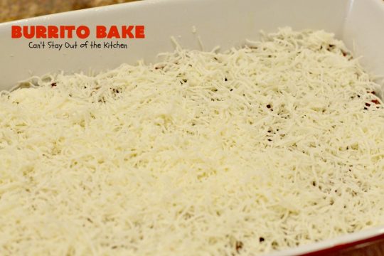 Burrito Bake | Can't Stay Out of the Kitchen | this incredibly easy #TexMex entree is layered with #crescentrolls, a #beef & #refriedbeans mixture, two cheeses & topped with olives, tomatoes & lettuce. It's served with #salsa & #guacamole for a fabulous one-dish meal that's perfect for weeknight suppers or company dinners.