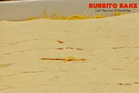 Burrito Bake | Can't Stay Out of the Kitchen | this incredibly easy #TexMex entree is layered with #crescentrolls, a #beef & #refriedbeans mixture, two cheeses & topped with olives, tomatoes & lettuce. It's served with #salsa & #guacamole for a fabulous one-dish meal that's perfect for weeknight suppers or company dinners.