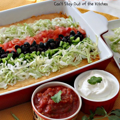 Burrito Bake | Can't Stay Out of the Kitchen | this incredibly easy #TexMex entree is layered with #crescentrolls, a #beef & #refriedbeans mixture, two cheeses & topped with olives, tomatoes & lettuce. It's served with #salsa & #guacamole for a fabulous one-dish meal that's perfect for weeknight suppers or company dinners.