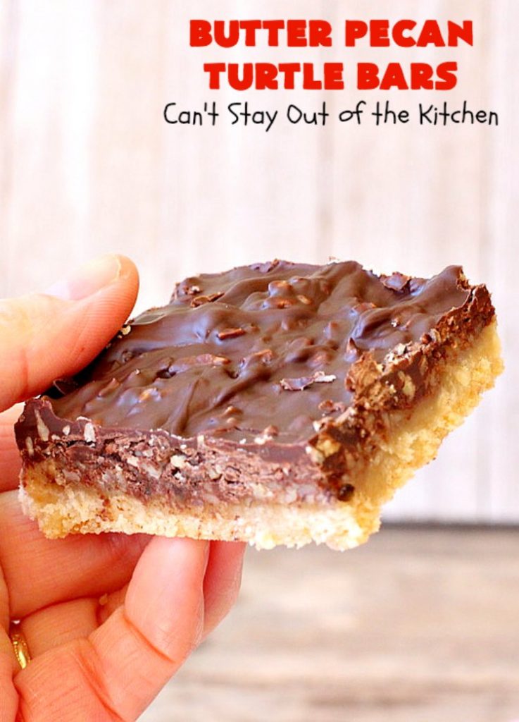 Butter Pecan Turtle Bars | These amazing layered #cookies have a shortbread crust. They're topped with #pecans & a homemade #caramel layer. Then they're covered with #chocolatechips while hot. That layer is spread into a delicious #chocolate icing. Perfect for #tailgating parties, soccer games, backyard barbecues, baby showers or potlucks. #ChocolateDessert #ButterPecanDessert #TurtleDessert #TurtleBars