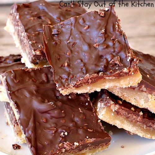 Butter Pecan Turtle Bars | These amazing layered #cookies have a shortbread crust. They're topped with #pecans & a homemade #caramel layer. Then they're covered with #chocolatechips while hot. That layer is spread into a delicious #chocolate icing. Perfect for #tailgating parties, soccer games, backyard barbecues, baby showers or potlucks. #ChocolateDessert #ButterPecanDessert #TurtleDessert #TurtleBars