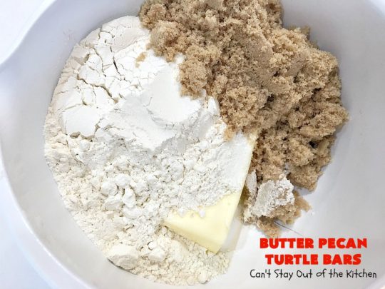 Butter Pecan Turtle Bars | These amazing layered #cookies have a shortbread crust. They're topped with #pecans & a homemade #caramel layer. Then they're covered with #chocolatechips while hot. That layer is spread into a delicious #chocolate icing. Perfect for #tailgating parties, soccer games, backyard barbecues, baby showers or potlucks. #ChocolateDessert #ButterPecanDessert #TurtleDessert #TurtleBars