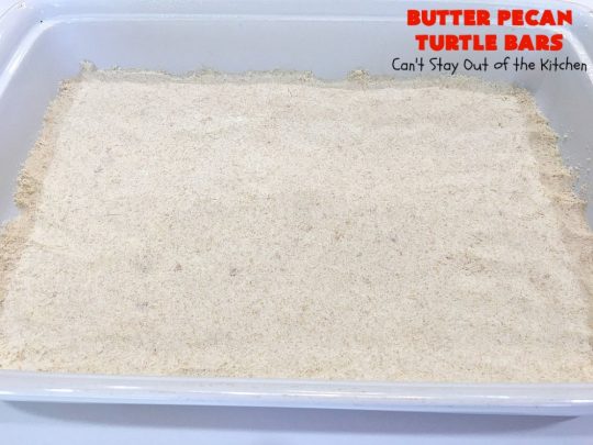 Butter Pecan Turtle Bars | These amazing layered #cookies have a shortbread crust. They're topped with #pecans & a homemade #caramel layer. Then they're covered with #chocolatechips while hot. That layer is spread into a delicious #chocolate icing. Perfect for #tailgating parties, soccer games, backyard barbecues, baby showers or potlucks. #ChocolateDessert #ButterPecanDessert #TurtleDessert #TurtleBars