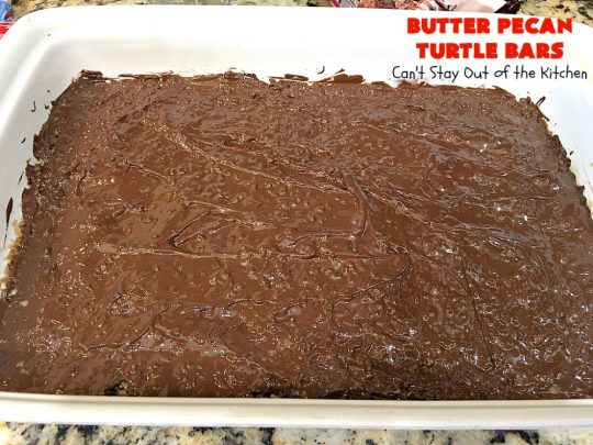 Butter Pecan Turtle Bars | These amazing layered #cookies have a shortbread crust. They're topped with #pecans & a homemade #caramel layer. Then they're covered with #chocolatechips while hot. That layer is spread into a delicious #chocolate icing. Perfect for #tailgating parties, soccer games, backyard barbecues, baby showers or potlucks. #ChocolateDessert #ButterPecanDessert #TurtleDessert #TurtleBars