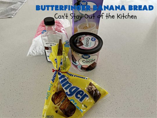 Butterfinger Banana Bread | Can't Stay Out of the Kitchen | No one will be able to resist this outrageous #ButterfingerBananaBread #recipe! It's fantastic for a weekend, company or #holiday #breakfast or #brunch. Every bite is chocked full of #Butterfingers so it has those great #chocolaty & #PeanutButter flavors that everyone loves. The rich, decadent #chocolate icing makes it even better! #SweetBread #ButterfingerCandyBars #ButterfingerCandy