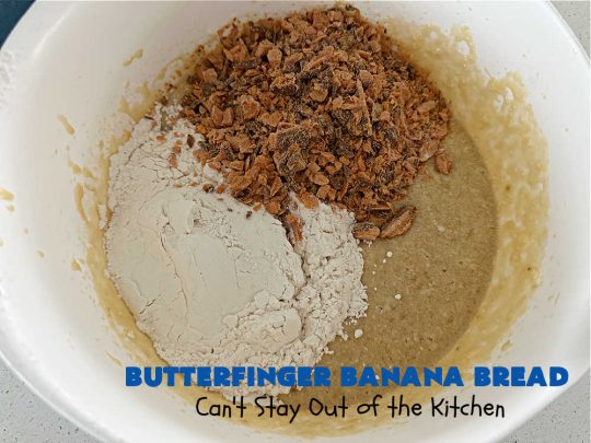 Butterfinger Banana Bread | Can't Stay Out of the Kitchen | No one will be able to resist this outrageous #ButterfingerBananaBread #recipe! It's fantastic for a weekend, company or #holiday #breakfast or #brunch. Every bite is chocked full of #Butterfingers so it has those great #chocolaty & #PeanutButter flavors that everyone loves. The rich, decadent #chocolate icing makes it even better! #SweetBread #ButterfingerCandyBars #ButterfingerCandy