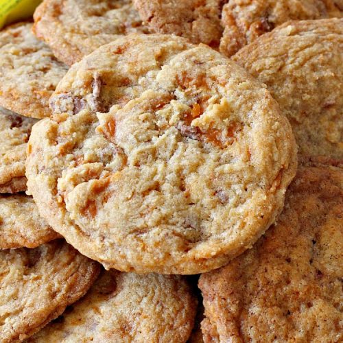 Butterfinger Candy Bar Cookies | Can't Stay Out of the Kitchen | these fantastic #cookies rock! They're filled with chopped #Butterfinger bars so they're absolutely mouthwatering & delicious. Great for #holiday or #tailgating parties or a #ChristmasCookieExchange. #dessert #HowToUseHalloweenCandy #ButterfingerBars #ButterfingerCandyBars #chocolate #ChocolateDessert #PeanutButter #PeanutButterDessert #ButterfingerDessert #ButterfingerCandyBarCookies #HolidayDessert