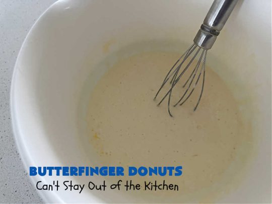 Butterfinger Donuts | Can't Stay Out of the Kitchen | Prepare to swoon over every delicious bite of #ButterfingerDonuts! These luscious #donuts include #Butterfingers in the donut as well as on top of the #ChocolateFrosting. Every bite will rock your world! Terrific for a weekend, company or #holiday breakfast or #brunch. #HolidayBreakfast #BakedDonuts #ButterfingerCandyBars