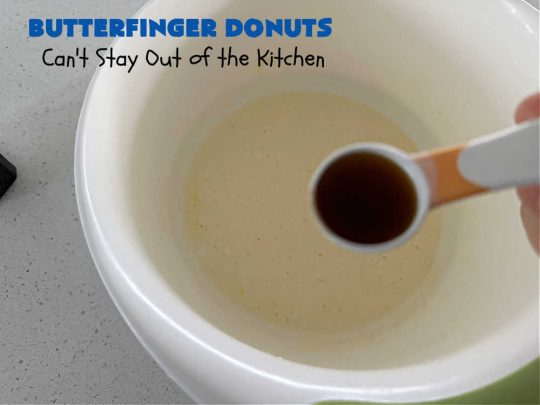Butterfinger Donuts | Can't Stay Out of the Kitchen | Prepare to swoon over every delicious bite of #ButterfingerDonuts! These luscious #donuts include #Butterfingers in the donut as well as on top of the #ChocolateFrosting. Every bite will rock your world! Terrific for a weekend, company or #holiday breakfast or #brunch. #HolidayBreakfast #BakedDonuts #ButterfingerCandyBars