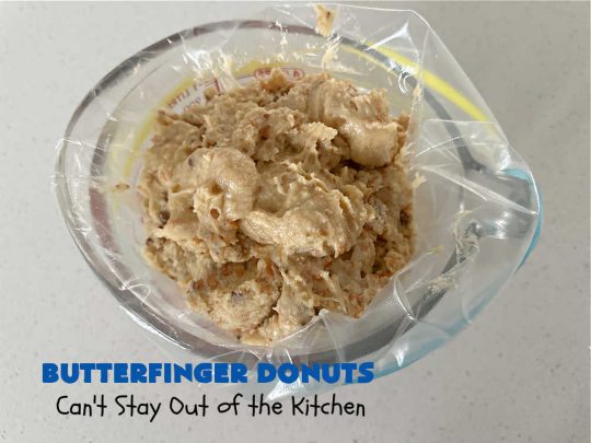 Butterfinger Donuts | Can't Stay Out of the Kitchen | Prepare to swoon over every delicious bite of #ButterfingerDonuts! These luscious #donuts include #Butterfingers in the donut as well as on top of the #ChocolateFrosting. Every bite will rock your world! Terrific for a weekend, company or #holiday breakfast or #brunch. #HolidayBreakfast #BakedDonuts #ButterfingerCandyBars