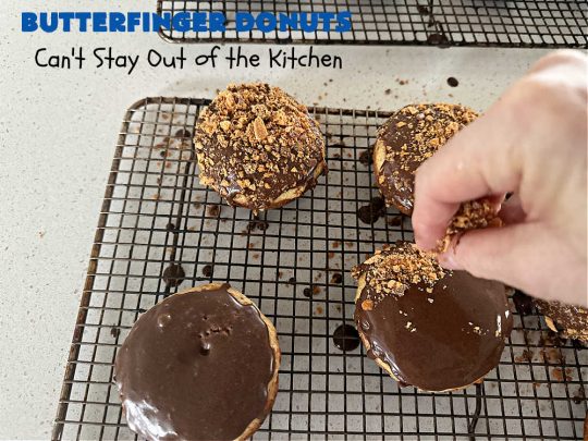 Butterfinger Donuts | Can't Stay Out of the Kitchen | Prepare to swoon over every delicious bite of #ButterfingerDonuts! These luscious #donuts include #Butterfingers in the donut as well as on top of the #ChocolateFrosting. Every bite will rock your world! Terrific for a weekend, company or #holiday breakfast or #brunch. #HolidayBreakfast #BakedDonuts #ButterfingerCandyBars