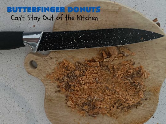 Butterfinger Donuts | Can't Stay Out of the Kitchen | Prepare to swoon over every delicious bite of #ButterfingerDonuts! These luscious #donuts include #Butterfingers in the donut as well as on top of the #ChocolateFrosting. Every bite will rock your world! Terrific for a weekend, company or #holiday breakfast or #brunch. #HolidayBreakfast #BakedDonuts #ButterfingerCandyBars
