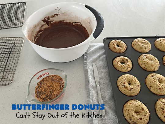 Butterfinger Donuts | Can't Stay Out of the Kitchen | Prepare to swoon over every delicious bite of #ButterfingerDonuts! These luscious #donuts include #Butterfingers in the donut as well as on top of the #ChocolateFrosting. Every bite will rock your world! Terrific for a weekend, company or #holiday breakfast or #brunch. #HolidayBreakfast #BakedDonuts #ButterfingerCandyBars