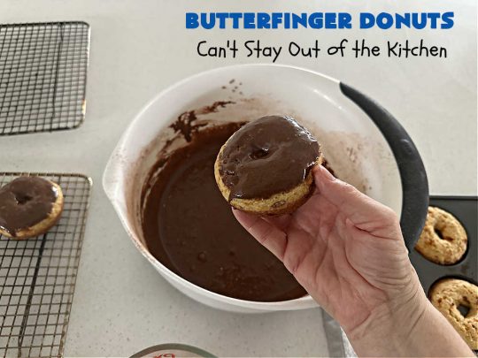 Butterfinger Donuts | Can't Stay Out of the Kitchen | Prepare to swoon over every delicious bite of #ButterfingerDonuts! These luscious #donuts include #Butterfingers in the donut as well as on top of the #ChocolateFrosting. Every bite will rock your world! Terrific for a weekend, company or #holiday breakfast or #brunch. #HolidayBreakfast #BakedDonuts #ButterfingerCandyBars