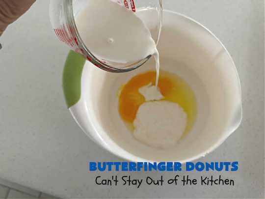 Butterfinger Donuts | Can't Stay Out of the Kitchen | Prepare to swoon over every delicious bite of #ButterfingerDonuts! These luscious #donuts include #Butterfingers in the donut as well as on top of the #ChocolateFrosting. Every bite will rock your world! Terrific for a weekend, company or #holiday breakfast or #brunch. #HolidayBreakfast #BakedDonuts #ButterfingerCandyBars