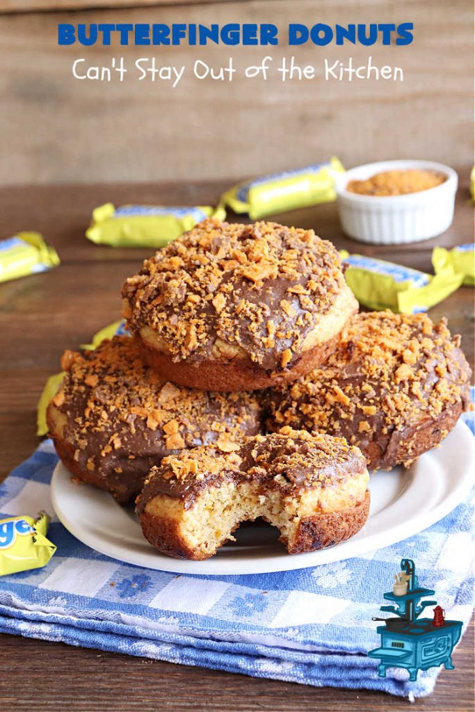 Butterfinger Donuts | Can't Stay Out of the Kitchen | Prepare to swoon over every delicious bite of #ButterfingerDonuts! These luscious #donuts include #Butterfingers in the donut as well as on top of the #ChocolateFrosting. Every bite will rock your world! Terrific for a weekend, company or #holiday breakfast or #brunch. #HolidayBreakfast #BakedDonuts #ButterfingerCandyBars