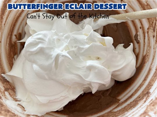 Butterfinger Éclair Dessert | Can't Stay Out of the Kitchen | this spectacular #ButterfingerÉclairDessert uses only 6 ingredients & is the perfect #dessert for company or #holidays. It serves a crowd & everyone enjoys the #GrahamCracker, #ChocolatePudding & #ChocolateFrosting layers that mimic Éclairs. You & your friends will swoon over this delicious #ButterfingerDessert. #Chocolate #ChocolateDessert #ButterfingerCandyBars