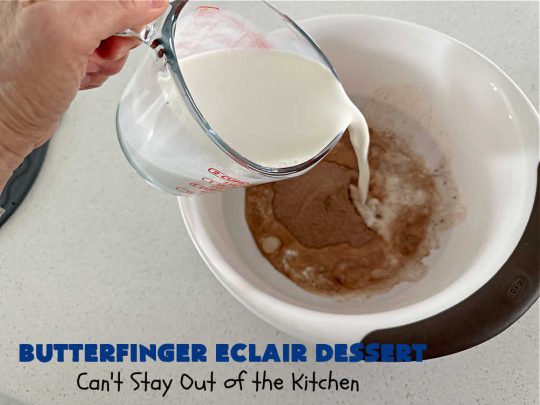 Butterfinger Éclair Dessert | Can't Stay Out of the Kitchen | this spectacular #ButterfingerÉclairDessert uses only 6 ingredients & is the perfect #dessert for company or #holidays. It serves a crowd & everyone enjoys the #GrahamCracker, #ChocolatePudding & #ChocolateFrosting layers that mimic Éclairs. You & your friends will swoon over this delicious #ButterfingerDessert. #Chocolate #ChocolateDessert #ButterfingerCandyBars