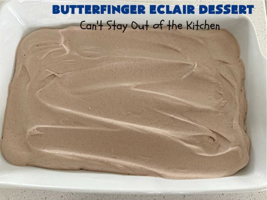 Butterfinger Éclair Dessert | Can't Stay Out of the Kitchen | this spectacular #ButterfingerÉclairDessert uses only 6 ingredients & is the perfect #dessert for company or #holidays. It serves a crowd & everyone enjoys the #GrahamCracker, #ChocolatePudding & #ChocolateFrosting layers that mimic Éclairs. You & your friends will swoon over this delicious #ButterfingerDessert. #Chocolate #ChocolateDessert #ButterfingerCandyBars