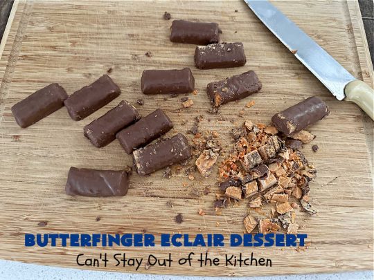 Butterfinger Éclair Dessert | Can't Stay Out of the Kitchen | this spectacular #ButterfingerÉclairDessert uses only 6 ingredients & is the perfect #dessert for company or #holidays. It serves a crowd & everyone enjoys the #GrahamCracker, #ChocolatePudding & #ChocolateFrosting layers that mimic Éclairs. You & your friends will swoon over this delicious #ButterfingerDessert. #Chocolate #ChocolateDessert #ButterfingerCandyBars