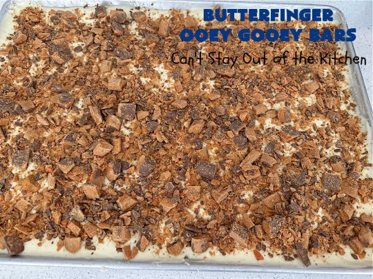 Butterfinger Ooey Gooey Bars | Can't Stay Out of the Kitchen | these lovely #OoeyGooeyBars include a #Cheesecake filling with chopped #Butterfingers on top! This easy 6-ingredient #recipe is so irresistible everyone will want seconds. They are out of this world good & will have you swooning from the first bite. Excellent for #tailgating, potlucks & a #ChristmasCookieExchange. #cookie #brownie #dessert #ButterfingerDessert #ButterfingerOoeyGooeyBars