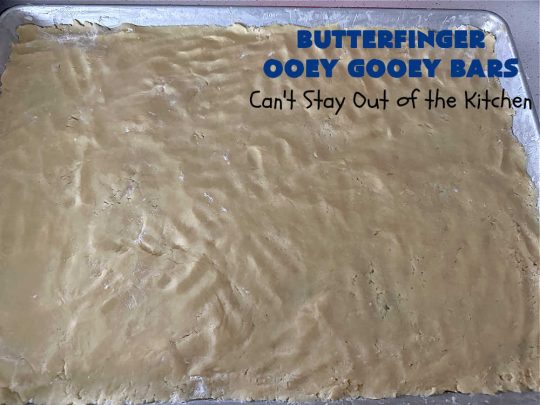 Butterfinger Ooey Gooey Bars | Can't Stay Out of the Kitchen | these lovely #OoeyGooeyBars include a #Cheesecake filling with chopped #Butterfingers on top! This easy 6-ingredient #recipe is so irresistible everyone will want seconds. They are out of this world good & will have you swooning from the first bite. Excellent for #tailgating, potlucks & a #ChristmasCookieExchange. #cookie #brownie #dessert #ButterfingerDessert #ButterfingerOoeyGooeyBars