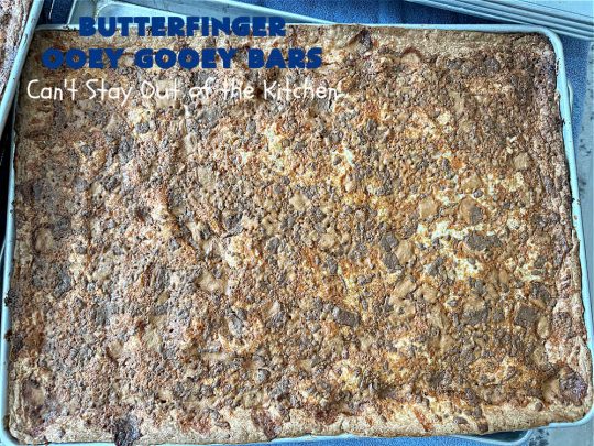 Butterfinger Ooey Gooey Bars | Can't Stay Out of the Kitchen | these lovely #OoeyGooeyBars include a #Cheesecake filling with chopped #Butterfingers on top! This easy 6-ingredient #recipe is so irresistible everyone will want seconds. They are out of this world good & will have you swooning from the first bite. Excellent for #tailgating, potlucks & a #ChristmasCookieExchange. #cookie #brownie #dessert #ButterfingerDessert #ButterfingerOoeyGooeyBars