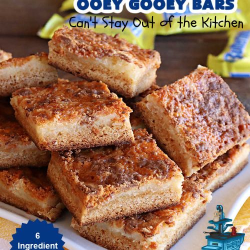 Butterfinger Ooey Gooey Bars | Can't Stay Out of the Kitchen | these lovely #OoeyGooeyBars include a #Cheesecake filling with chopped #Butterfingers on top! This easy 6-ingredient #recipe is so irresistible everyone will want seconds. They are out of this world good & will have you swooning from the first bite. Excellent for #tailgating, potlucks & a #ChristmasCookieExchange. #cookie #brownie #dessert #ButterfingerDessert #ButterfingerOoeyGooeyBars