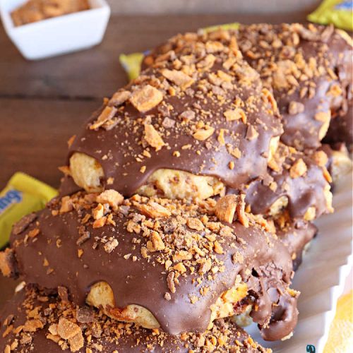 Butterfinger Scones | Can't Stay Out of the Kitchen | Delight your family & friends with these spectacular #ButterfingerScones on your next #breakfast buffet. After just one bite they'll be swooning. These luscious #scones are sweeter than the traditional variety & include #Butterfingers & a luscious #chocolate #icing with more #ButterfingerCandyBars sprinkled over top. Perfect for a weekend, company or #holiday breakfast. Utterly irresistible! #chocolate #PeanutButter #HolidayBreakfast