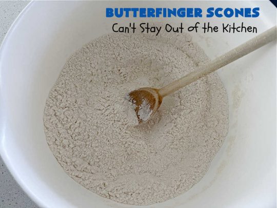 Butterfinger Scones | Can't Stay Out of the Kitchen | Delight your family & friends with these spectacular #ButterfingerScones on your next #breakfast buffet. After just one bite they'll be swooning. These luscious #scones are sweeter than the traditional variety & include #Butterfingers & a luscious #chocolate #icing with more #ButterfingerCandyBars sprinkled over top. Perfect for a weekend, company or #holiday breakfast. Utterly irresistible! #chocolate #PeanutButter #HolidayBreakfast