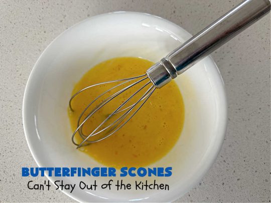 Butterfinger Scones | Can't Stay Out of the Kitchen | Delight your family & friends with these spectacular #ButterfingerScones on your next #breakfast buffet. After just one bite they'll be swooning. These luscious #scones are sweeter than the traditional variety & include #Butterfingers & a luscious #chocolate #icing with more #ButterfingerCandyBars sprinkled over top. Perfect for a weekend, company or #holiday breakfast. Utterly irresistible! #chocolate #PeanutButter #HolidayBreakfast