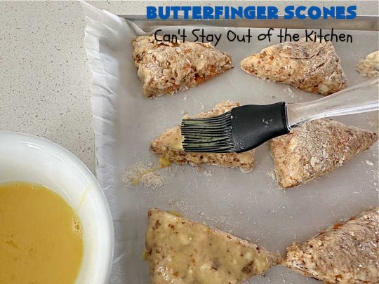 Butterfinger Scones | Can't Stay Out of the Kitchen | Delight your family & friends with these spectacular #ButterfingerScones on your next #breakfast buffet. After just one bite they'll be swooning. These luscious #scones are sweeter than the traditional variety & include #Butterfingers & a luscious #chocolate #icing with more #ButterfingerCandyBars sprinkled over top. Perfect for a weekend, company or #holiday breakfast. Utterly irresistible! #chocolate #PeanutButter #HolidayBreakfast
