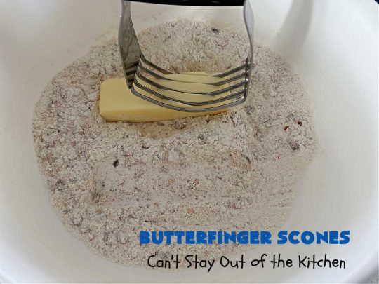 Butterfinger Scones | Can't Stay Out of the Kitchen | Delight your family & friends with these spectacular #ButterfingerScones on your next #breakfast buffet. After just one bite they'll be swooning. These luscious #scones are sweeter than the traditional variety & include #Butterfingers & a luscious #chocolate #icing with more #ButterfingerCandyBars sprinkled over top. Perfect for a weekend, company or #holiday breakfast. Utterly irresistible! #chocolate #PeanutButter #HolidayBreakfast