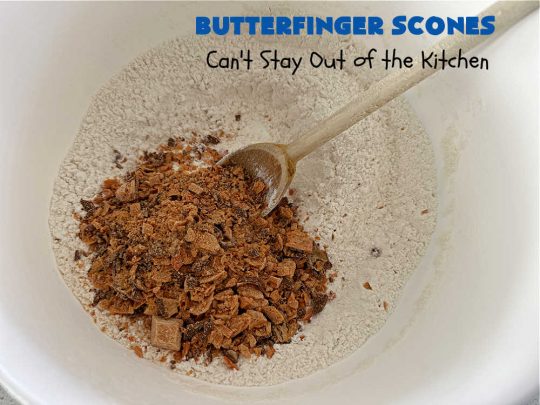 Butterfinger Scones | Can't Stay Out of the Kitchen | Delight your family & friends with these spectacular #ButterfingerScones on your next #breakfast buffet. After just one bite they'll be swooning. These luscious #scones are sweeter than the traditional variety & include #Butterfingers & a luscious #chocolate #icing with more #ButterfingerCandyBars sprinkled over top. Perfect for a weekend, company or #holiday breakfast. Utterly irresistible! #chocolate #PeanutButter #HolidayBreakfast