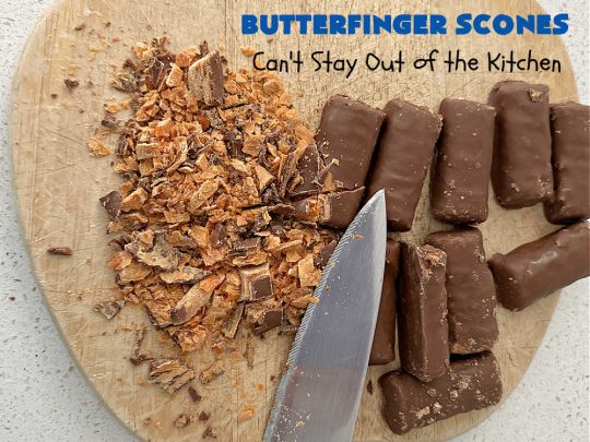 Butterfinger Scones | Can't Stay Out of the Kitchen | Delight your family & friends with these spectacular #ButterfingerScones on your next #breakfast buffet. After just one bite they'll be swooning. These luscious #scones are sweeter than the traditional variety & include #Butterfingers & a luscious #chocolate #icing with more #ButterfingerCandyBars sprinkled over top. Perfect for a weekend, company or #holiday breakfast. Utterly irresistible! #chocolate #PeanutButter #HolidayBreakfast