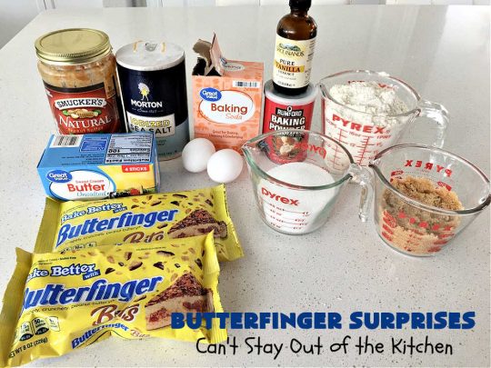 Butterfinger Surprises | Can't Stay Out of the Kitchen | these luscious #PeanutButterCookies include #ButterfingerBits in every bite. These whopper-sized #cookies will knock your socks off! If you enjoy #PeanutButter #chocolate & #Butterfingers, this #dessert will make your day! #ChocolateDessert #PeanutButterDessert #Butterfinger Dessert #holiday #HolidayBaking #HolidayDessert #ButterfingerSurprises
