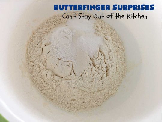 Butterfinger Surprises | Can't Stay Out of the Kitchen | these luscious #PeanutButterCookies include #ButterfingerBits in every bite. These whopper-sized #cookies will knock your socks off! If you enjoy #PeanutButter #chocolate & #Butterfingers, this #dessert will make your day! #ChocolateDessert #PeanutButterDessert #Butterfinger Dessert #holiday #HolidayBaking #HolidayDessert #ButterfingerSurprises