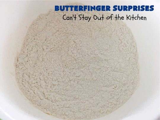 Butterfinger Surprises | Can't Stay Out of the Kitchen | these luscious #PeanutButterCookies include #ButterfingerBits in every bite. These whopper-sized #cookies will knock your socks off! If you enjoy #PeanutButter #chocolate & #Butterfingers, this #dessert will make your day! #ChocolateDessert #PeanutButterDessert #Butterfinger Dessert #holiday #HolidayBaking #HolidayDessert #ButterfingerSurprises