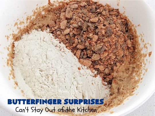 Butterfinger Surprises | Can't Stay Out of the Kitchen | these luscious #PeanutButterCookies include #ButterfingerBits in every bite. These whopper-sized #cookies will knock your socks off! If you enjoy #PeanutButter #chocolate & #Butterfingers, this #dessert will make your day! #ChocolateDessert #PeanutButterDessert #Butterfinger Dessert #holiday #HolidayBaking #HolidayDessert #ButterfingerSurprises