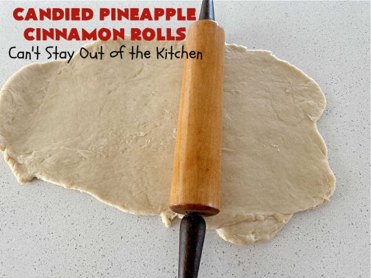 Candied Pineapple Cinnamon Rolls | Can't Stay Out of the Kitchen | These luscious #CinnamonRolls include #CandiedPineapple & they're iced with a thick, drool-worthy #buttercream icing. Every bite will rock your world! Enjoy for a #holiday #breakfast or #brunch. #Thanksgiving #Christmas #ParadiseFruit #pineapple #SweetRolls #HolidayBreakfast