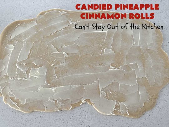 Candied Pineapple Cinnamon Rolls | Can't Stay Out of the Kitchen | These luscious #CinnamonRolls include #CandiedPineapple & they're iced with a thick, drool-worthy #buttercream icing. Every bite will rock your world! Enjoy for a #holiday #breakfast or #brunch. #Thanksgiving #Christmas #ParadiseFruit #pineapple #SweetRolls #HolidayBreakfast