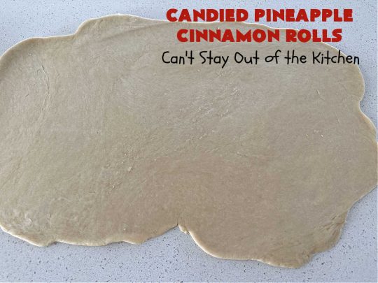 Candied Pineapple Cinnamon Rolls | Can't Stay Out of the Kitchen | These luscious #CinnamonRolls include #CandiedPineapple & they're iced with a thick, drool-worthy #buttercream icing. Every bite will rock your world! Enjoy for a #holiday #breakfast or #brunch. #Thanksgiving #Christmas #ParadiseFruit #pineapple #SweetRolls #HolidayBreakfast