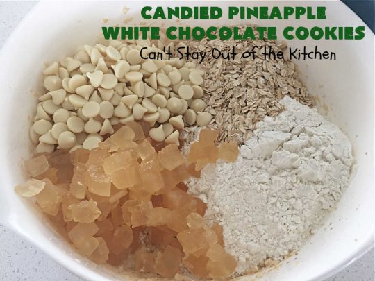 Candied Pineapple White Chocolate Cookies | these delightful #OatmealCookies include #CandiedPineapple & #WhiteChocolateChips for a robust flavor that will knock your socks off! Terrific for #holiday or #tailgating parties or a #ChristmasCookieExchange. #cookies #ParadiseCandiedFruit #chocolate #ParadiseFruitCompany #pineapple #holiday #dessert #HolidayDessert #HolidayBaking #Christmas #Thanksgiving #NewYearsDay #CandiedPineappleWhiteChocolateCookies