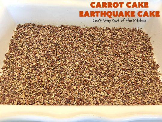 Carrot Cake Earthquake Cake | Can't Stay Out of the Kitchen | this fantastic #cake is rich, decadent & divine! It's layered with #pecans, #coconut, vanilla chips & uses a boxed #carrotcake mix. Then it has a #cheesecake icing layer that sinks into the #dessert while baking. The explosion causes an earthquake! Amazing dessert for company or #holidays.