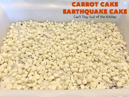 Carrot Cake Earthquake Cake | Can't Stay Out of the Kitchen | this fantastic #cake is rich, decadent & divine! It's layered with #pecans, #coconut, vanilla chips & uses a boxed #carrotcake mix. Then it has a #cheesecake icing layer that sinks into the #dessert while baking. The explosion causes an earthquake! Amazing dessert for company or #holidays.
