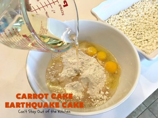 Carrot Cake Earthquake Cake | Can't Stay Out of the Kitchen | this fantastic #cake is rich, decadent & divine! It's layered with #pecans, #coconut, vanilla chips & uses a boxed #carrotcake mix. Then it has a #cheesecake icing layer that sinks into the #dessert while baking. The explosion causes an earthquake! Amazing dessert for company or #holidays.