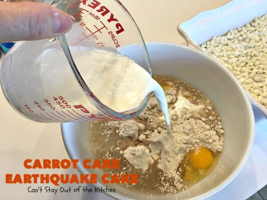 Carrot Cake Earthquake Cake | Can't Stay Out of the Kitchen | this fantastic #cake is rich, decadent & divine! It's layered with #pecans, #coconut, vanilla chips & uses a boxed #carrotcake mix. Then it has a #cheesecake icing layer that sinks into the #dessert while baking. The explosion causes an earthquake! Amazing dessert for company or #holidays.