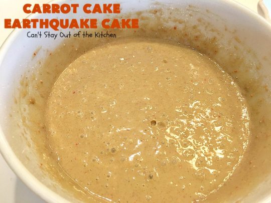 Carrot Cake Earthquake Cake | Can't Stay Out of the Kitchen | this fantastic #cake is rich, decadent & divine! It's layered with #pecans, #coconut, vanilla chips & uses a boxed #carrotcake mix. Then it has a #cheesecake icing layer that sinks into the #dessert while baking. The explosion causes an earthquake! Amazing dessert for company or #holidays.