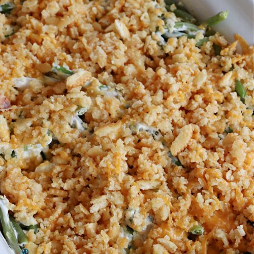 Cheesy Green Bean Casserole | Can't Stay Out of the Kitchen | this is NOT the typical #GreenBeanCasserole #recipe everyone makes for the #holidays. It's SO much better! This one has a #RitzCracker & #CheddarCheese topping. This is one of our favorite ways to enjoy #GreenBeans. Great for #MothersDay or #FathersDay. #CheesyGreenBeanCasserole